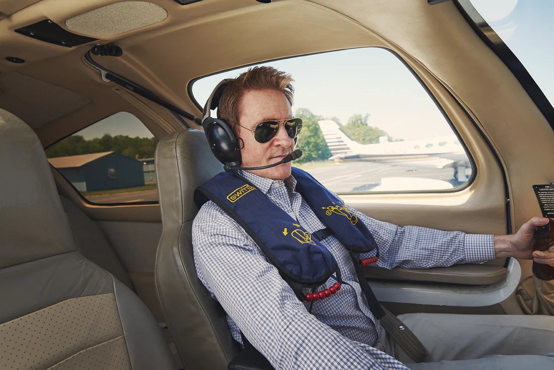 Pilot Wearing a Constant-Wear Life Vest in the Cockpit