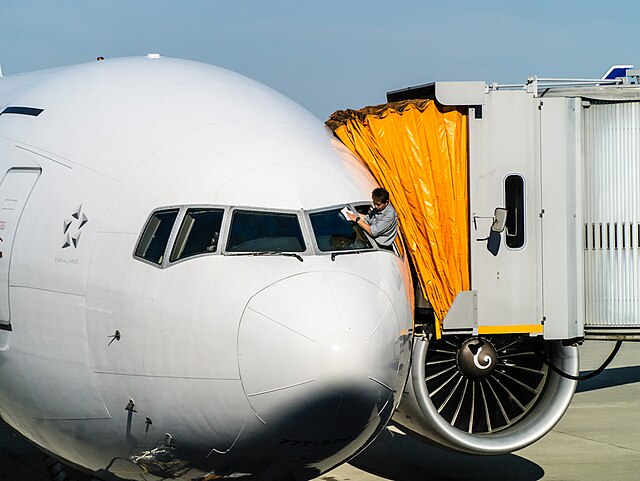 Cleaning Airplane Cockpit Windows &ndash; Source: Wikimedia Commons