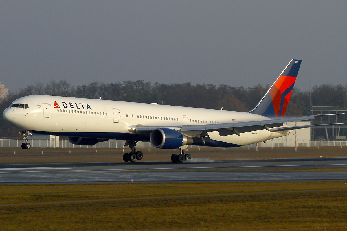 Delta Airlines Boeing 767-400ER landing at airport with landing gear down
