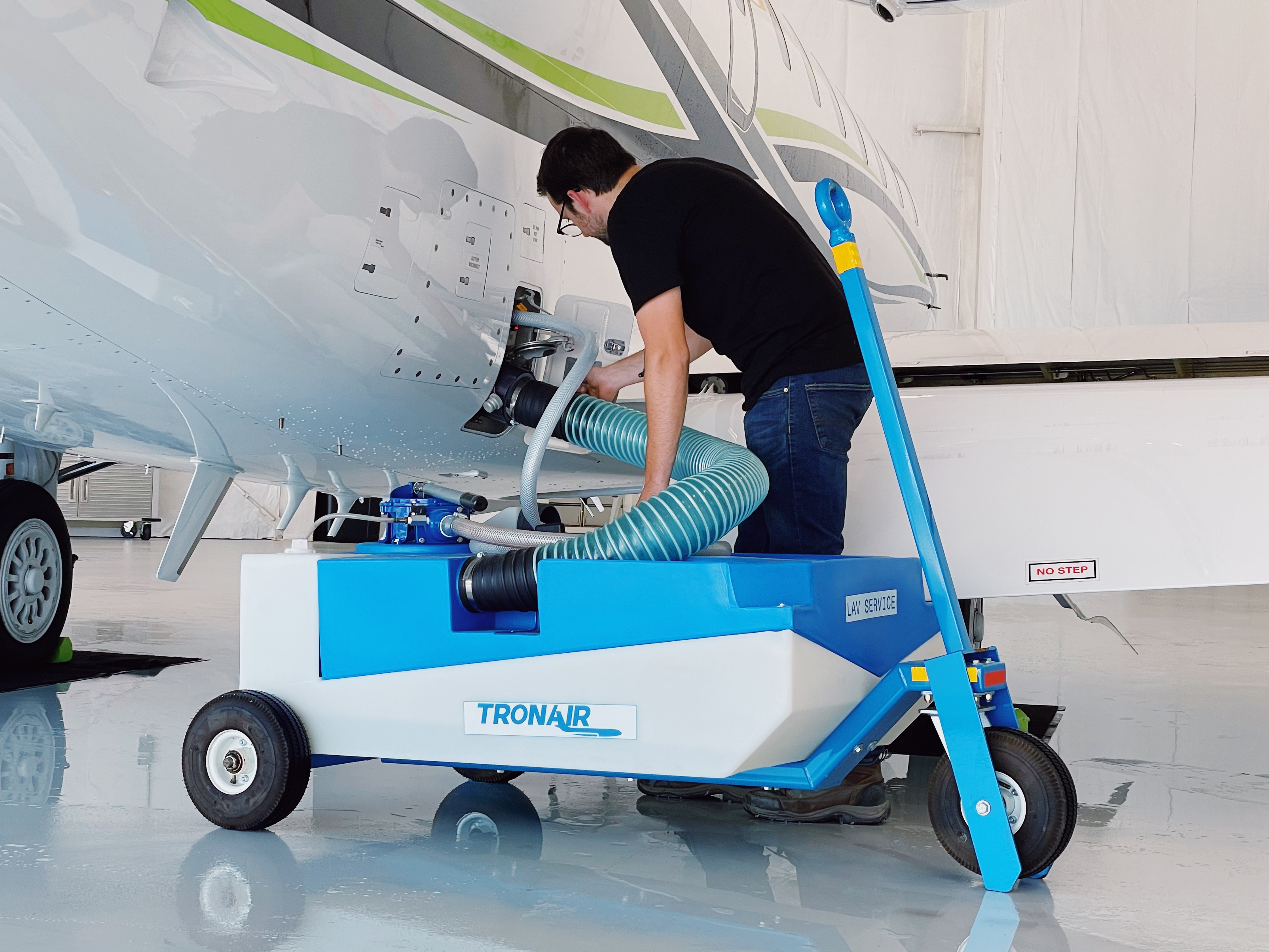 Man Operating a Tronair Aircraft Lavatory Service Cart