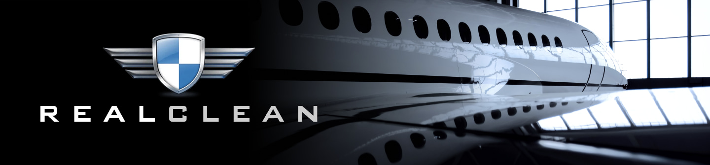 The RealClean Aviation Products Logo overlaying a black gradient background with an image of a shiny plane to the right.