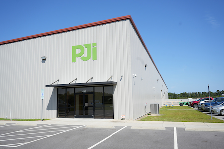 PJi distribution facility and service center with metal siding, front entrance, and adjacent parking lot in New Bern, North Carolina