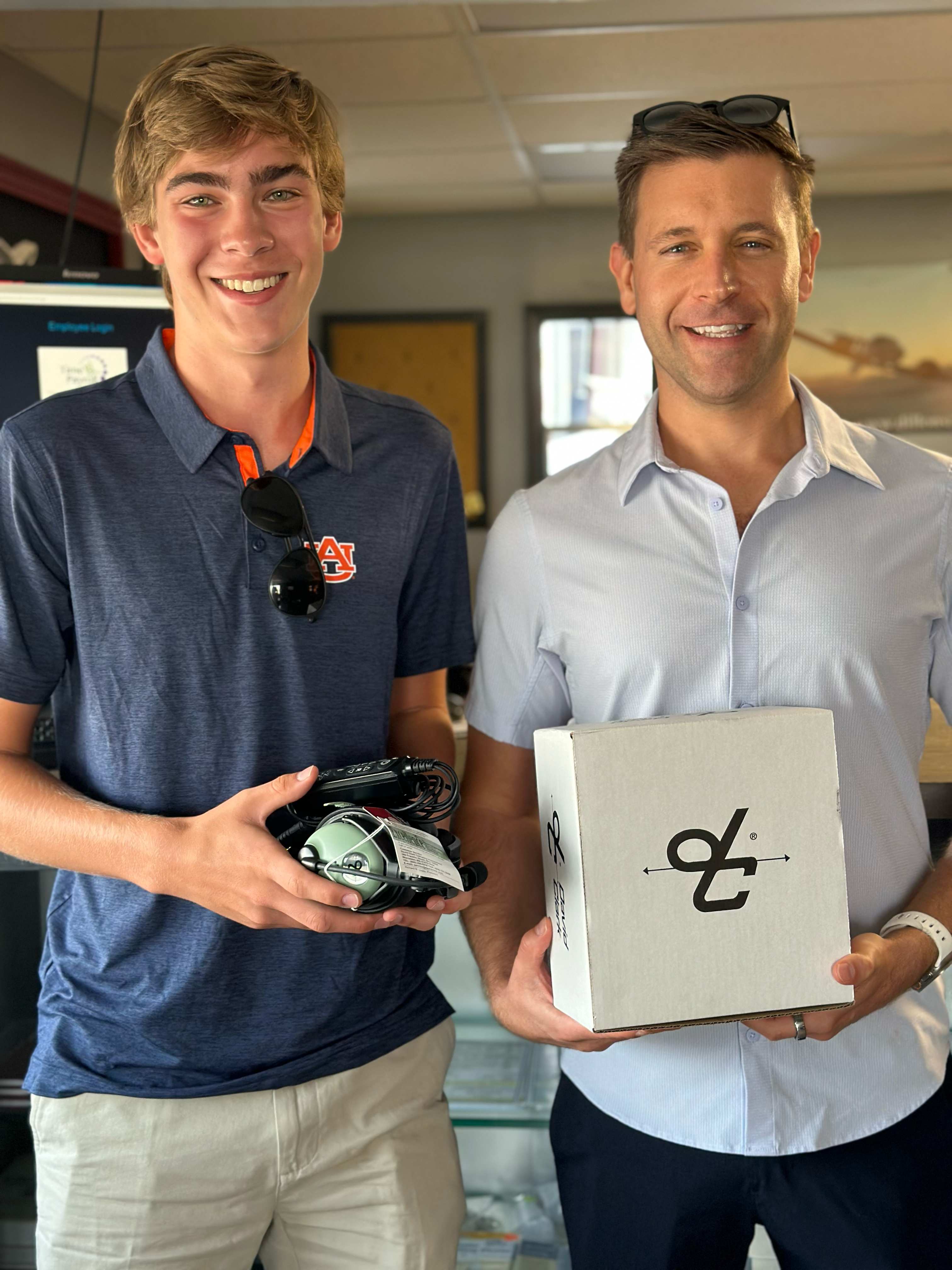 Ben Swaggerty accepting his gift of a David Clark pilot headset from John Werner