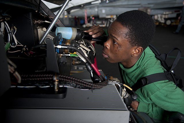 Man Inspecting Aircraft Up Close