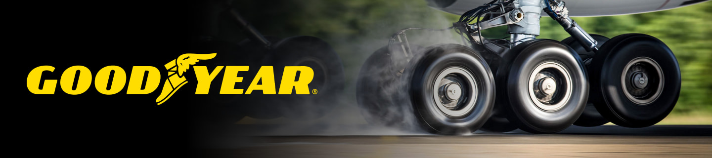 The Goodyear logo over an image of aircraft wheels in action during landing.