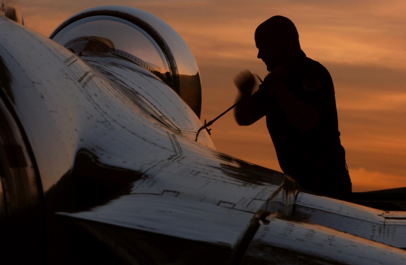 Aircraft Maintenance Technician Working on the Airframe of a Plane