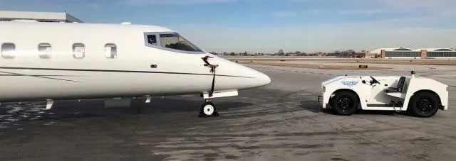 Eagle TTR-8 towing a white long-nosed airplane