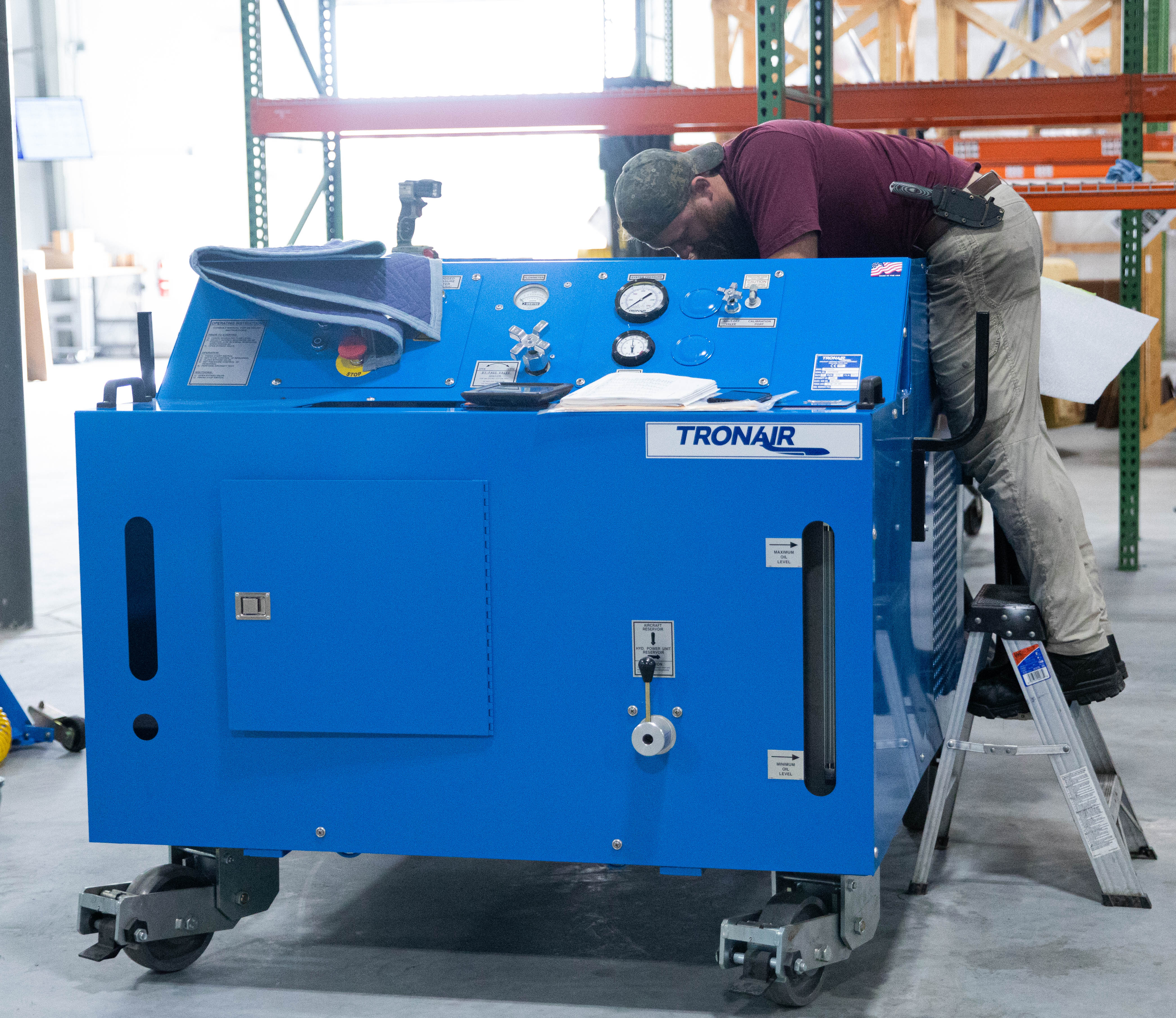 PJi Service Technician Working on a Tronair Hydraulic Power Unit (HPU)