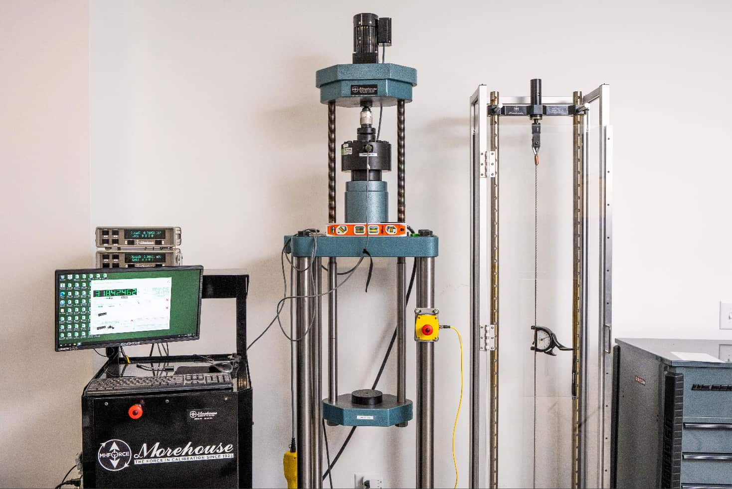 Calibration Equipment Lined Up Against the Wall in PJi's Calibration Lab